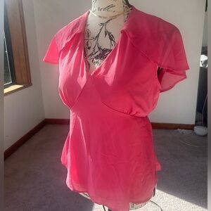 Airy light weight blouse, fit and flare style with a caped back shoulder